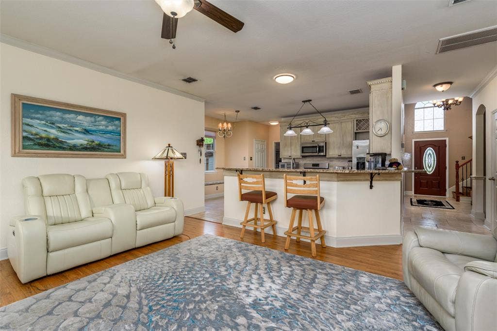 5800 Pine Ridge Boulevard, McKinney, TX 75070 Your living and kitchen area are open for a continuous flow from the front to back of the home.