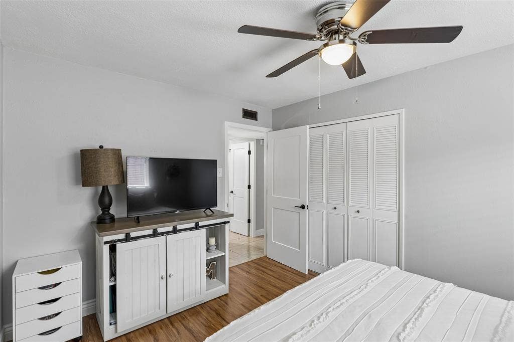 4021 Overdowns Drive, Plano, TX 75023 A dedicated closet and natural light keep this secondary bedroom simple and functional.