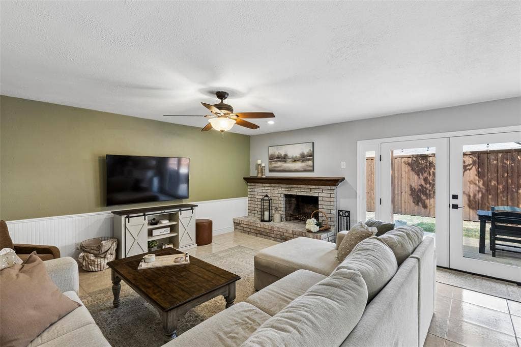 4021 Overdowns Drive, Plano, TX 75023 Room enough for a full sectional, with French doors framing a straight shot to the covered patio.