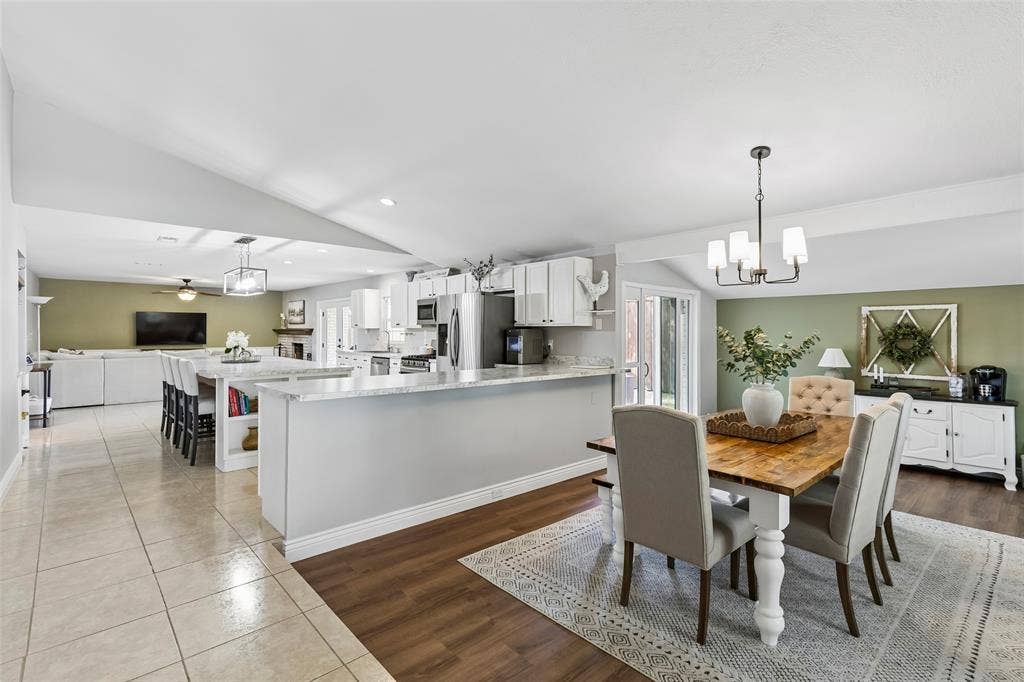 4021 Overdowns Drive, Plano, TX 75023 Built for hosting — the island anchors an open kitchen that flows straight into the dining room and living room beyond.