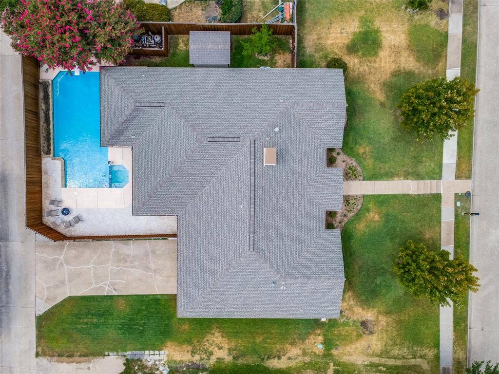 3632 Candelaria Drive, Plano, TX 75023 Private backyard with a swimming pool and attached spa