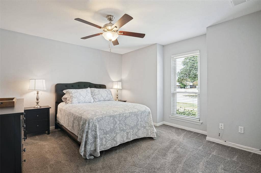3632 Candelaria Drive, Plano, TX 75023 Neutral wall paint, ceiling fan with light fixture, window with blinds, and carpet flooring