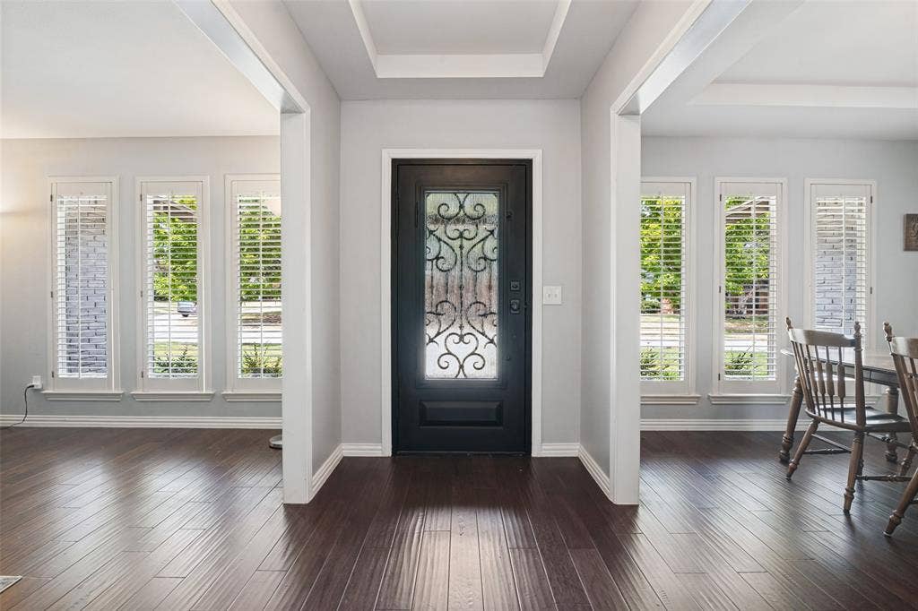 3632 Candelaria Drive, Plano, TX 75023 Entry featuring a dark-finish door with decorative ironwork
