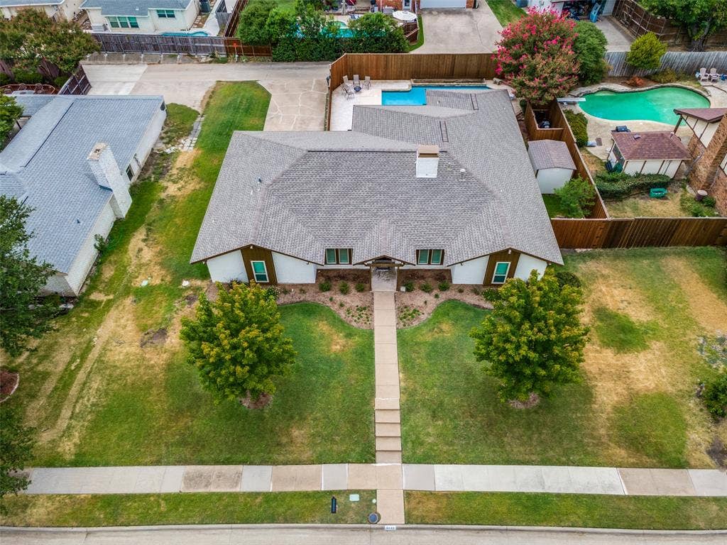 3632 Candelaria Drive, Plano, TX 75023 Front yard with a concrete walkway, mature trees, and landscaping