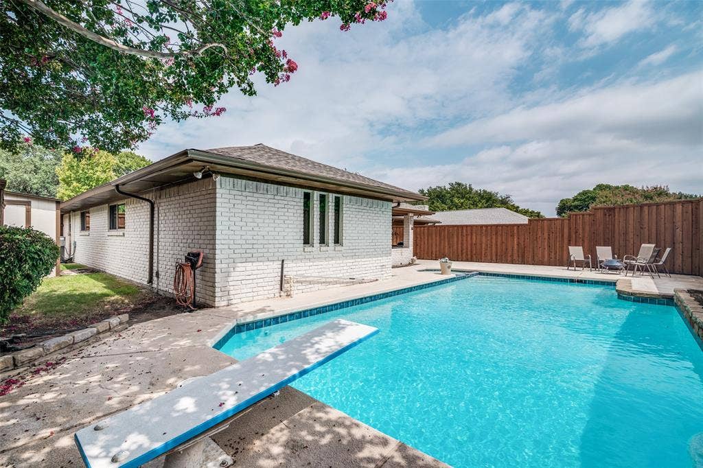 3632 Candelaria Drive, Plano, TX 75023 White brick exterior with a brown roof and gutters