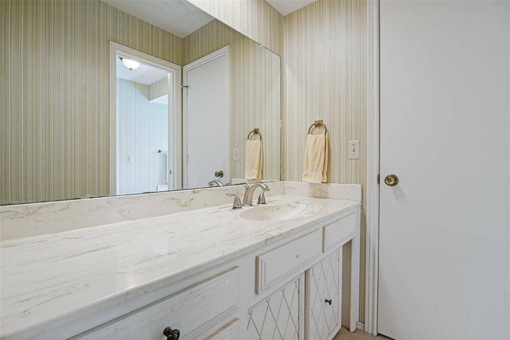 3632 Candelaria Drive, Plano, TX 75023 Vanity featuring a stone-finish countertop, integrated sink, and dual-handle faucet