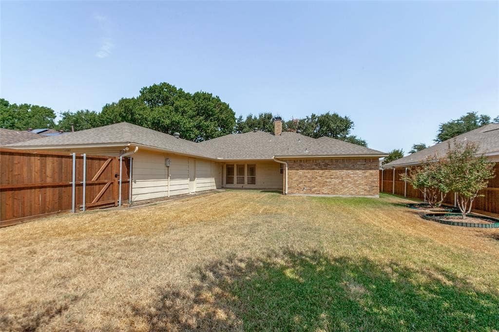 1700 Mayflower Drive, Richardson, TX 75081 Beautiful fence! And trees. Covered patio.