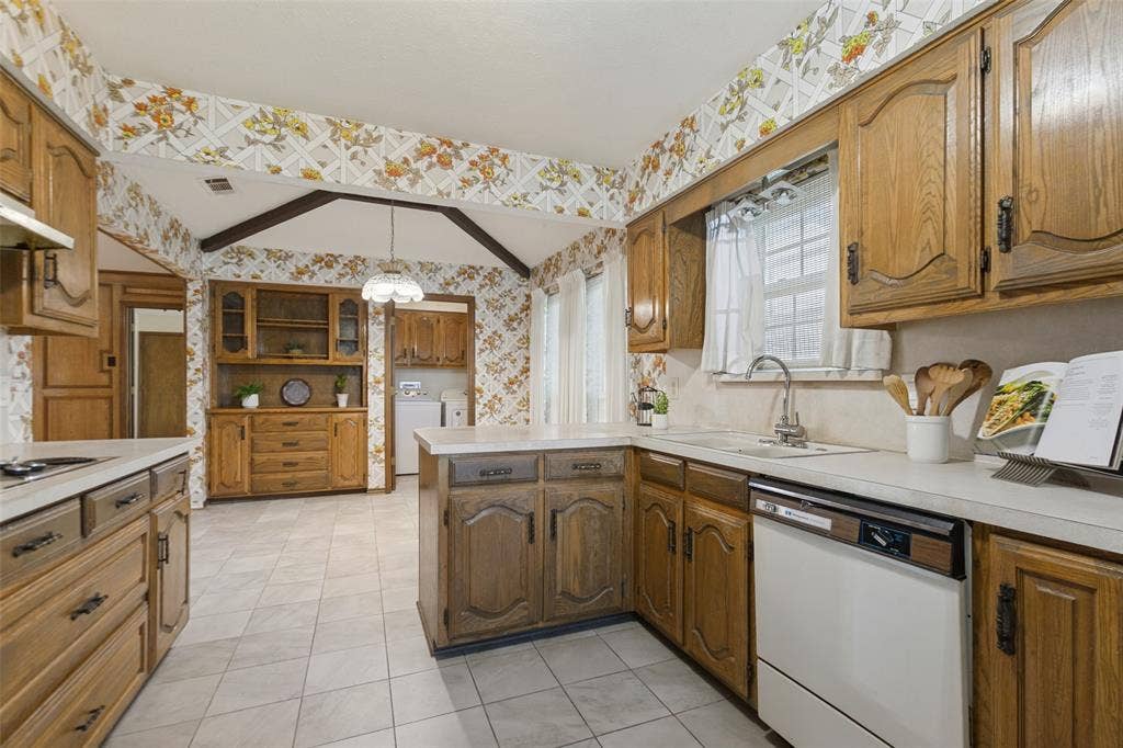 1700 Mayflower Drive, Richardson, TX 75081 View of casual dining with built-in hutch and door to utility room.