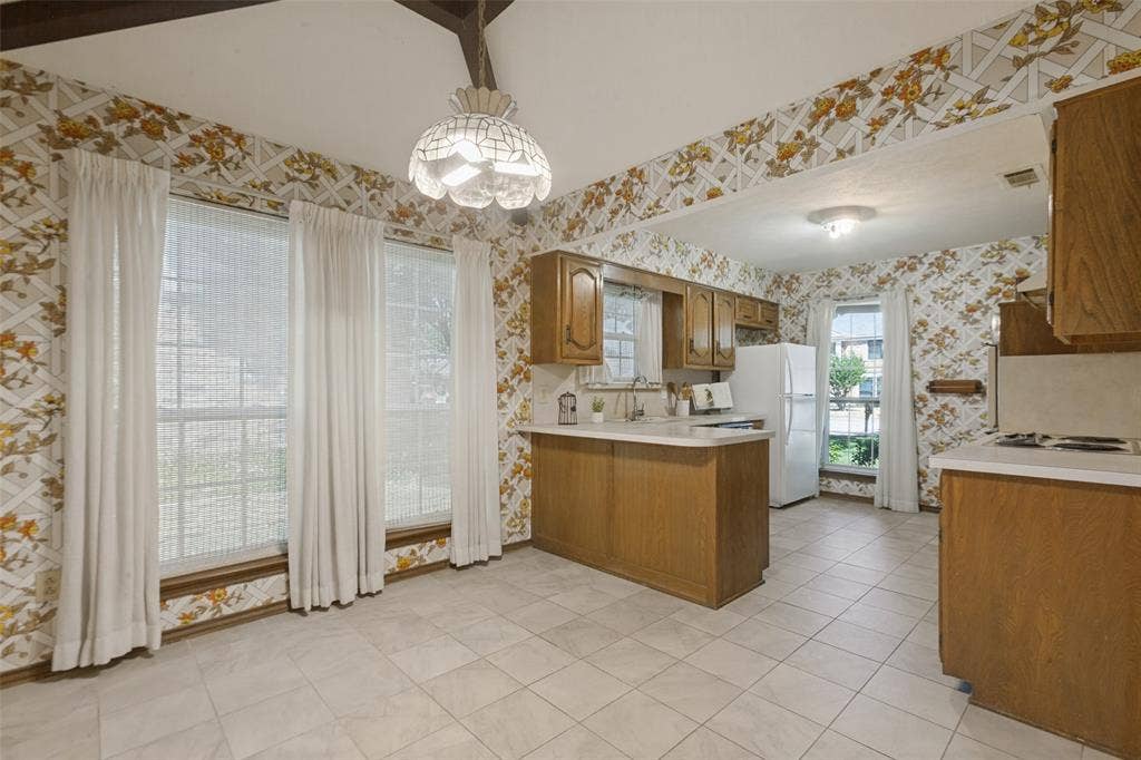 1700 Mayflower Drive, Richardson, TX 75081 Breakfast bar in light filled area of kitchen.