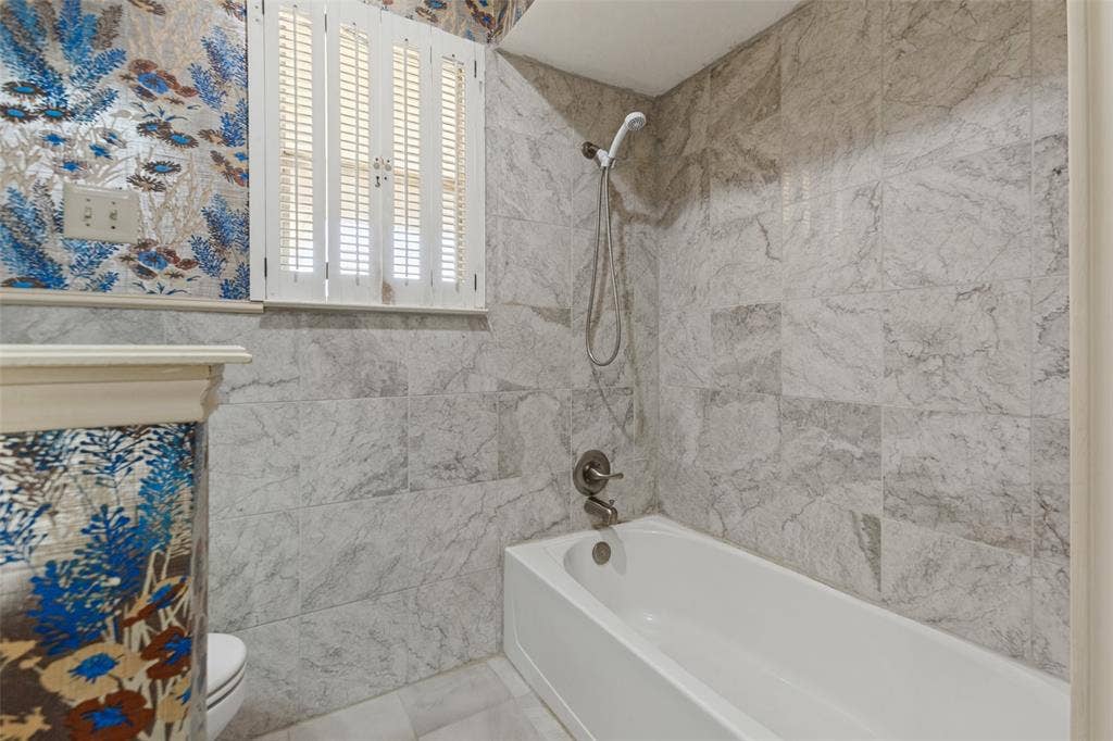 1700 Mayflower Drive, Richardson, TX 75081 Tub & shower surrounded by tile.
