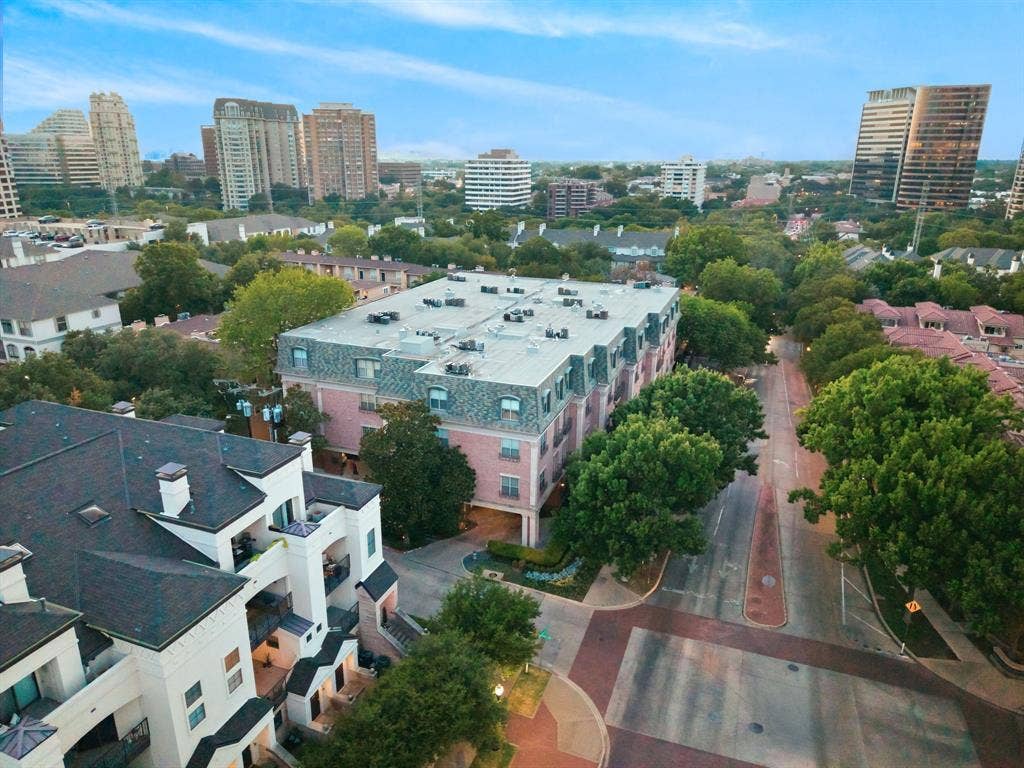 3303 Blackburn Street, #306, Dallas, TX 75204 Urban landscape featuring multiple residential buildings, mature trees, and a developed streetscape
