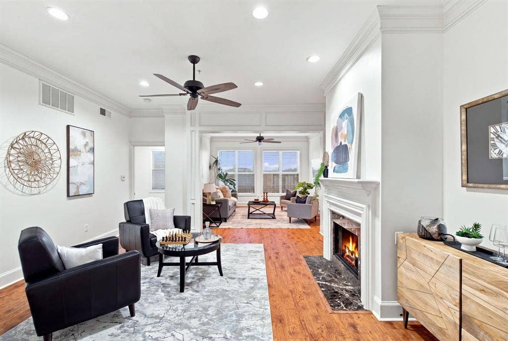 3303 Blackburn Street, #306, Dallas, TX 75204 Den with fireplace and living room.