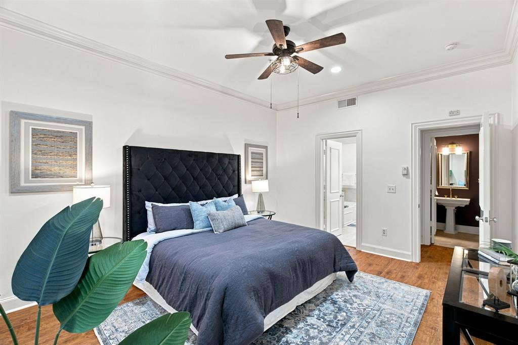 3303 Blackburn Street, #306, Dallas, TX 75204 Hardwood-finish flooring, crown molding, and a ceiling fan with light fixture
