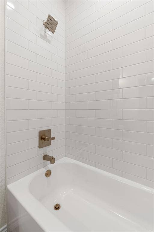 Full bathroom featuring washtub / shower combination