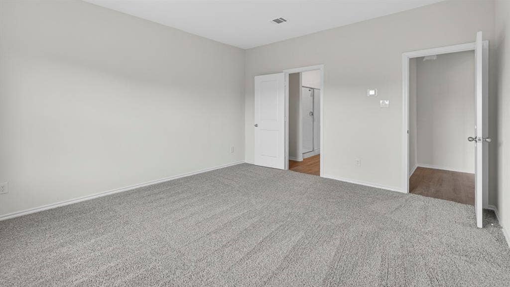 1920 Freeman Street, Tyler, TX 75704 Spacious room featuring light gray walls, gray carpet flooring, and white trim