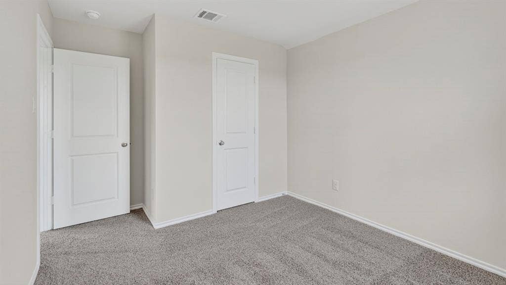 1920 Freeman Street, Tyler, TX 75704 Neutral gray carpeting complements freshly painted light gray walls