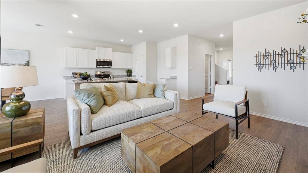 1932 Freeman Street, Tyler, TX 75704 Open-concept living space featuring wood-finish flooring, recessed lighting, and crisp white wall finishes