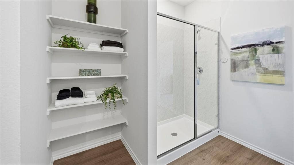 1932 Freeman Street, Tyler, TX 75704 Shower enclosure featuring a sliding glass door and white shower pan