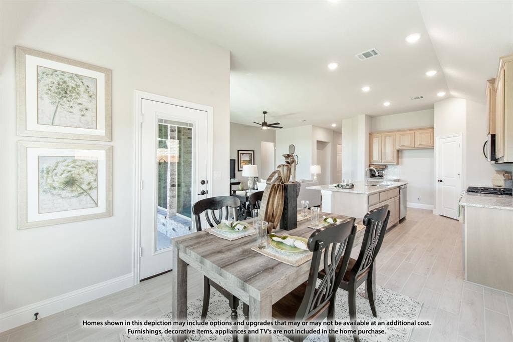 942 Cardinal Drive, Midlothian, TX 76065 Open-concept living area with wood-finish flooring, recessed lighting, and light-toned cabinetry