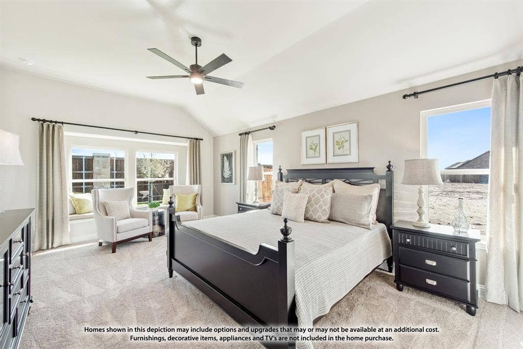 942 Cardinal Drive, Midlothian, TX 76065 Vaulted ceiling with a ceiling fan, carpeted flooring, multiple windows, and a built-in window seat
