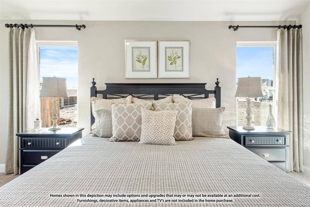 942 Cardinal Drive, Midlothian, TX 76065 Neutral wall color, two windows with drapery rods, and a dark wood-finish headboard