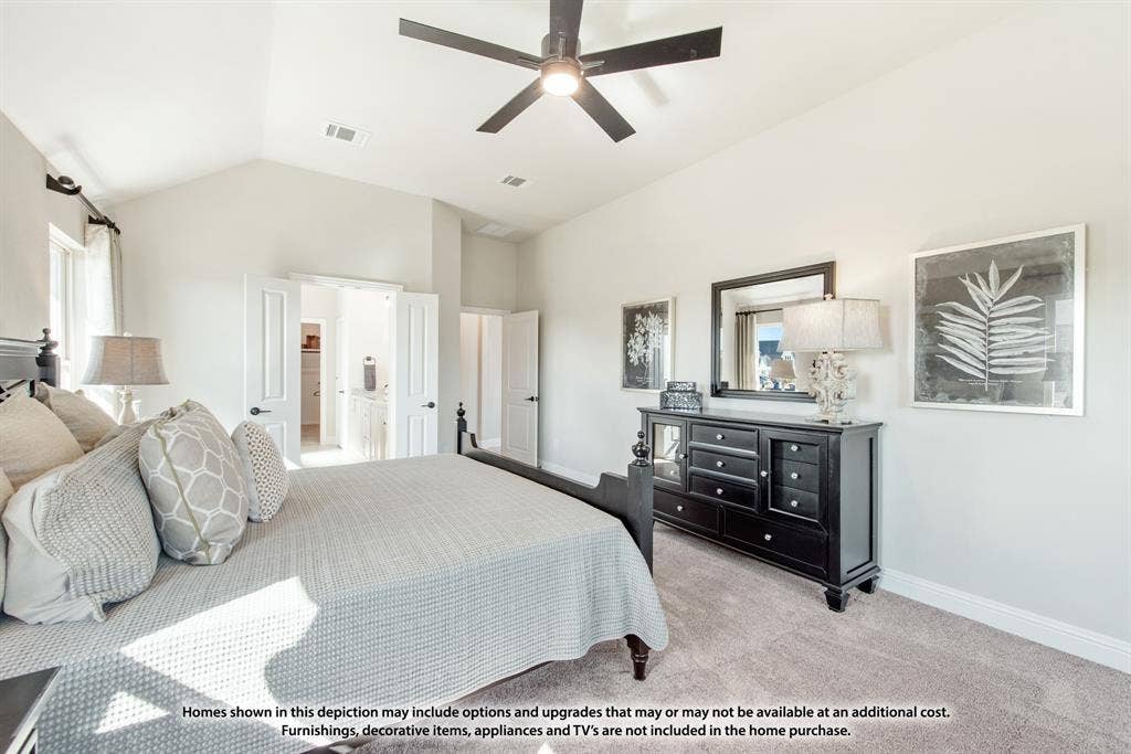 942 Cardinal Drive, Midlothian, TX 76065 Vaulted ceiling with a ceiling fan, light-toned carpeting, and white interior doors with dark hardware