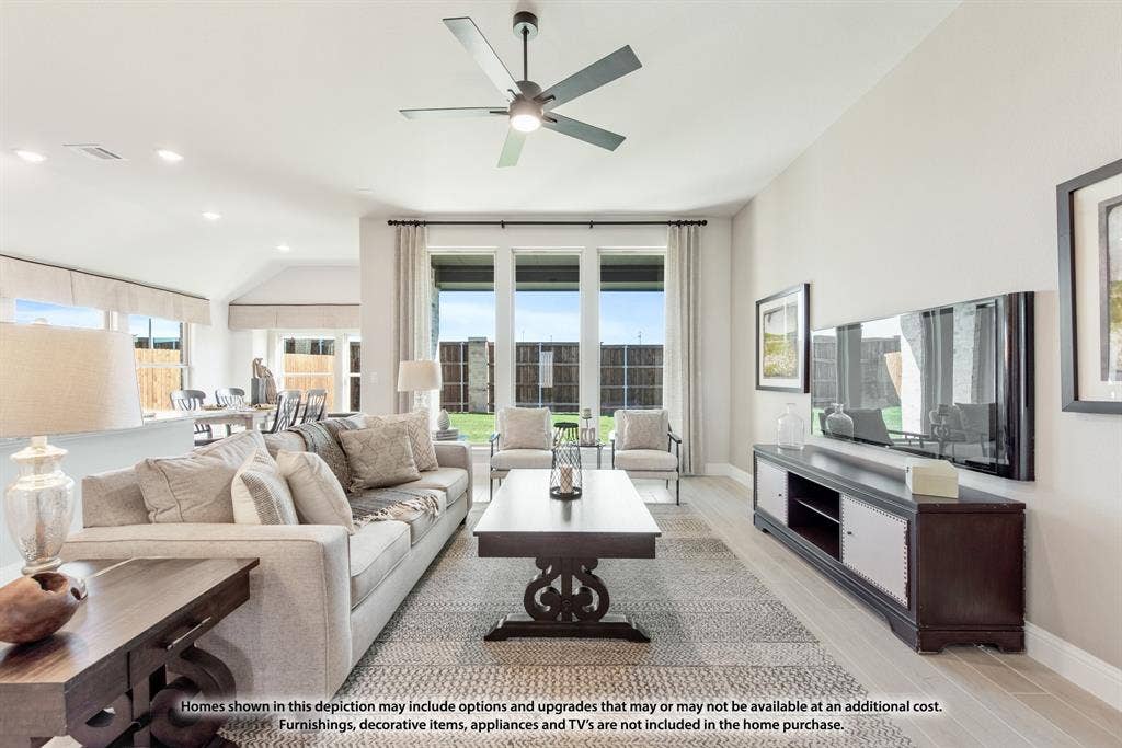 942 Cardinal Drive, Midlothian, TX 76065 Recessed lighting, wood-finish flooring, and a modern ceiling fan with integrated lighting