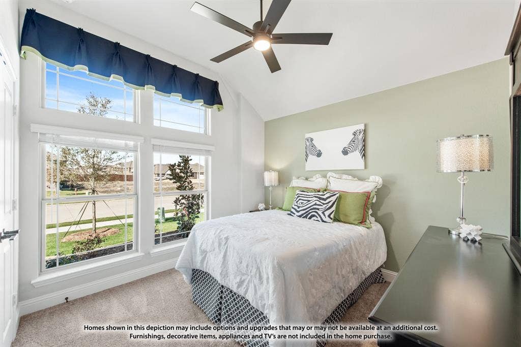 942 Cardinal Drive, Midlothian, TX 76065 Vaulted ceiling with a ceiling fan, transom windows, multiple double-hung windows, and neutral carpeting