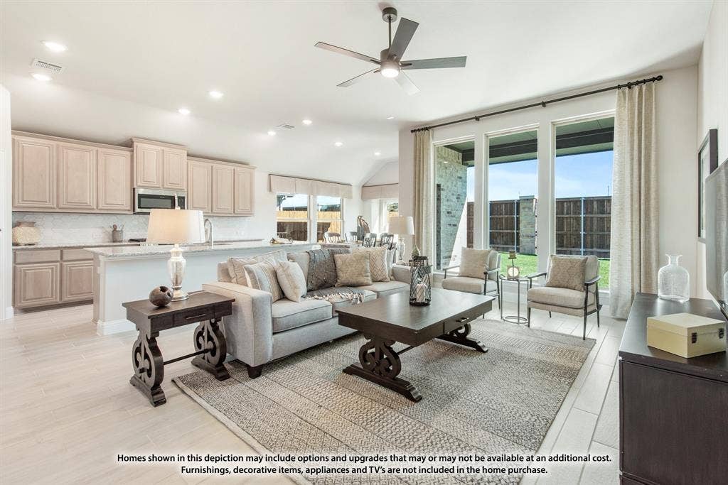 942 Cardinal Drive, Midlothian, TX 76065 Open-concept living area featuring a kitchen island, recessed lighting, ceiling fan, and large windows