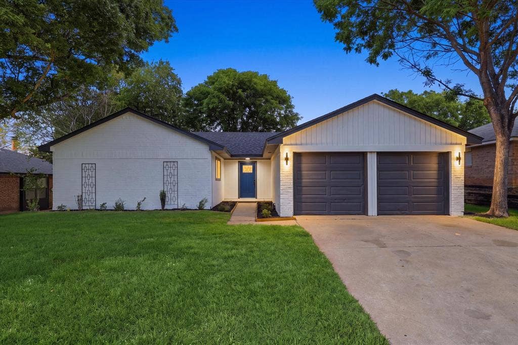 3405 Mill Ridge, Bedford, TX 76021 White brick exterior with a dark blue entry door