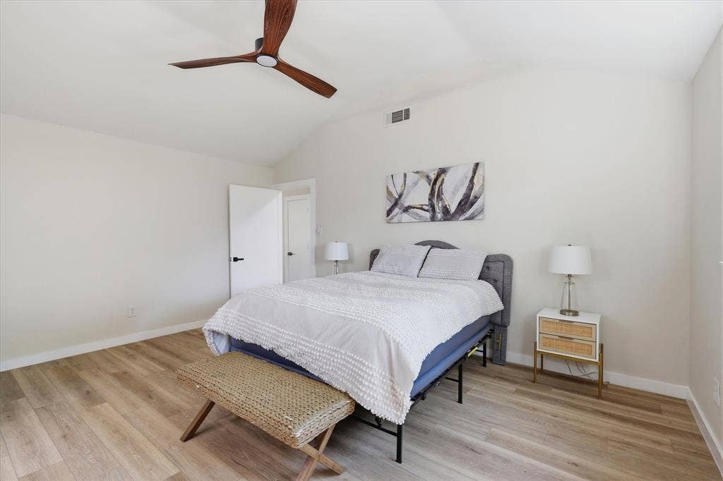 3405 Mill Ridge, Bedford, TX 76021 Vaulted ceiling, wood-finish flooring, modern ceiling fan, white paneled door, black door hardware