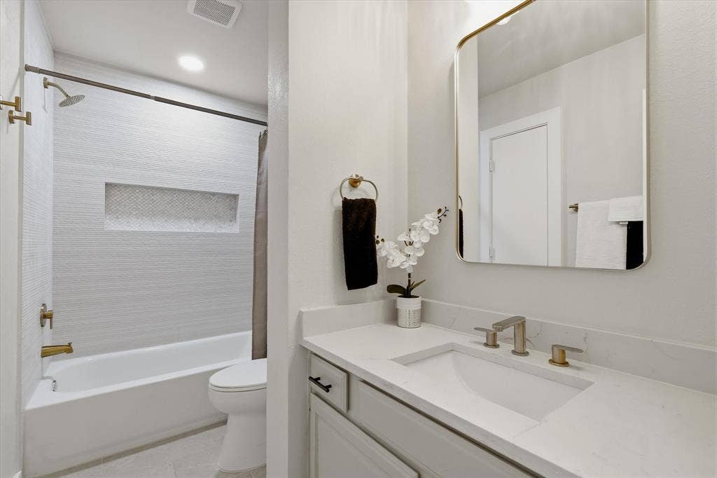 3405 Mill Ridge, Bedford, TX 76021 Modern vanity with an integrated sink and light-toned countertop