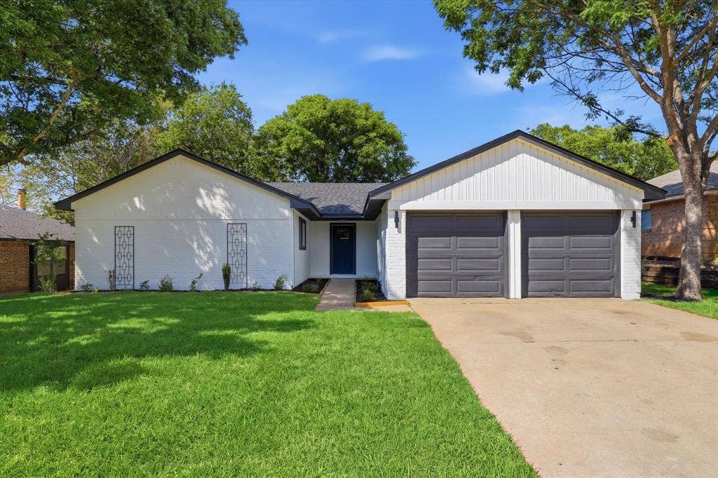 3405 Mill Ridge, Bedford, TX 76021 Painted white brick exterior with a dark gray exterior.