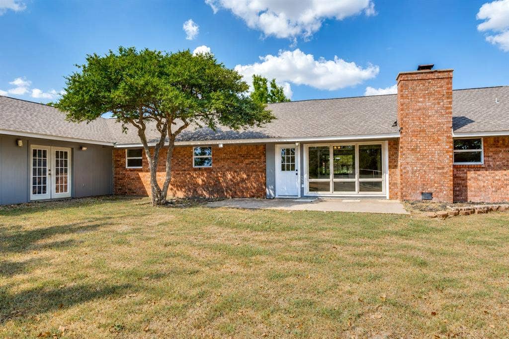 2406 County Road 852, McKinney, TX 75071 Brick exterior construction with a shingle roof