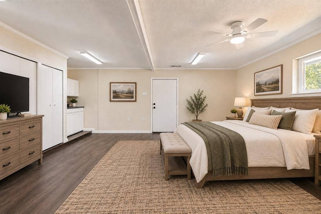 2406 County Road 852, McKinney, TX 75071 Wood-finish flooring with a ceiling fan, a window, and built-in white cabinetry