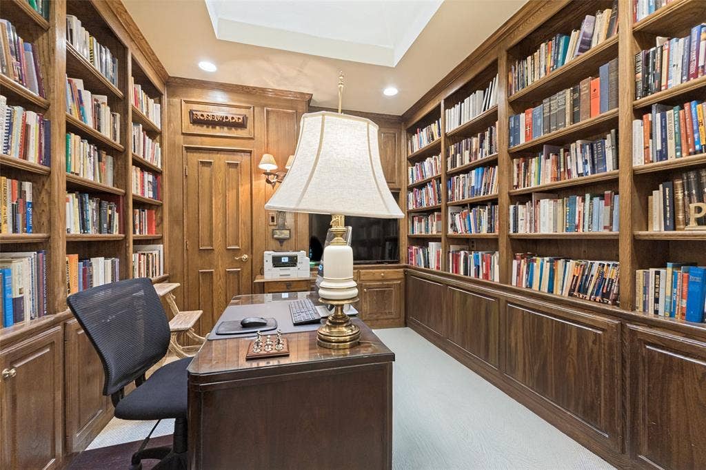 12012 Excelsior Way, Dallas, TX 75230 Built-in wood shelving and cabinetry with crown molding, wood paneling, and a recessed ceiling feature