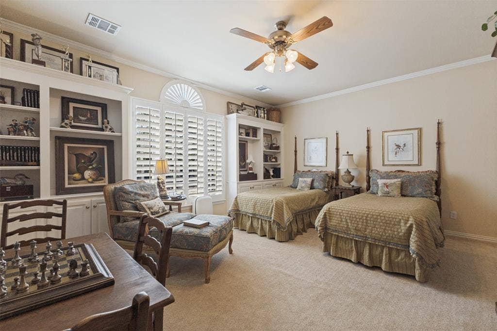 12012 Excelsior Way, Dallas, TX 75230 Built-in shelving, plantation shutters, and crown molding