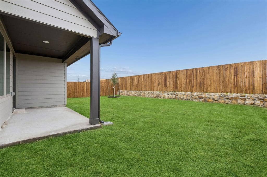 Covered Patio in the Oscar home plan by Trophy Signature Homes – REPRESENTATIVE PHOTO
