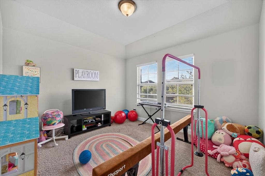 8712 Mccutchins Drive, McKinney, TX 75070 Recessed ceiling fixture, multiple windows with blinds, carpeted flooring, and light wall paint