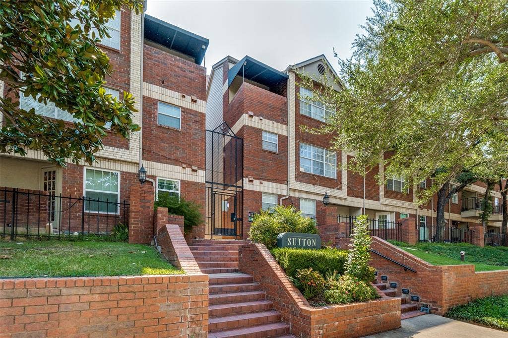 3100 Cole Avenue, #213, Dallas, TX 75204 View of building exterior with a residential view and stairs
