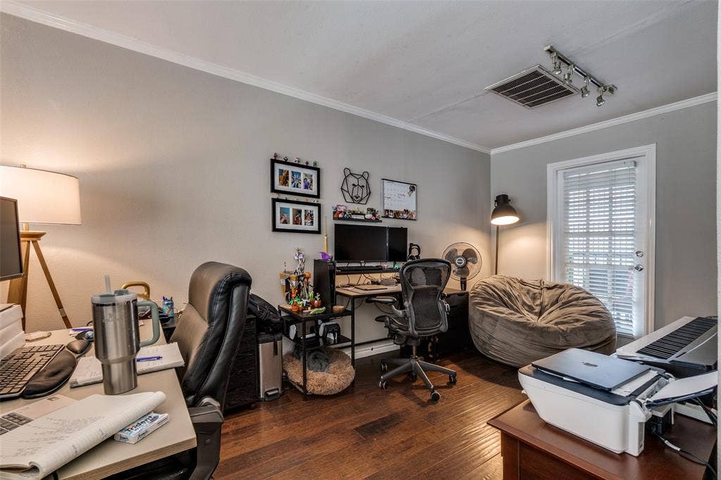3100 Cole Avenue, #213, Dallas, TX 75204 Office featuring ornamental molding, dark wood finished floors, and track lighting