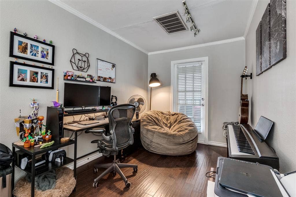 3100 Cole Avenue, #213, Dallas, TX 75204 Office space with ornamental molding, dark wood-type flooring, and track lighting