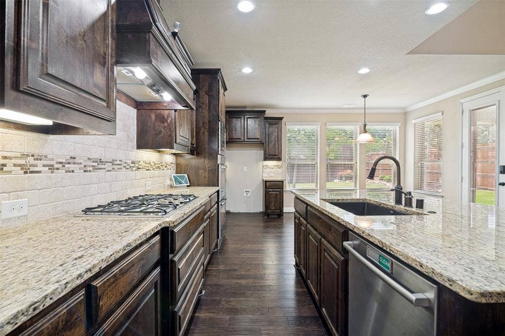 10002 Edgeway Circle, Rowlett, TX 75089 Kitchen with breakfast area in background.