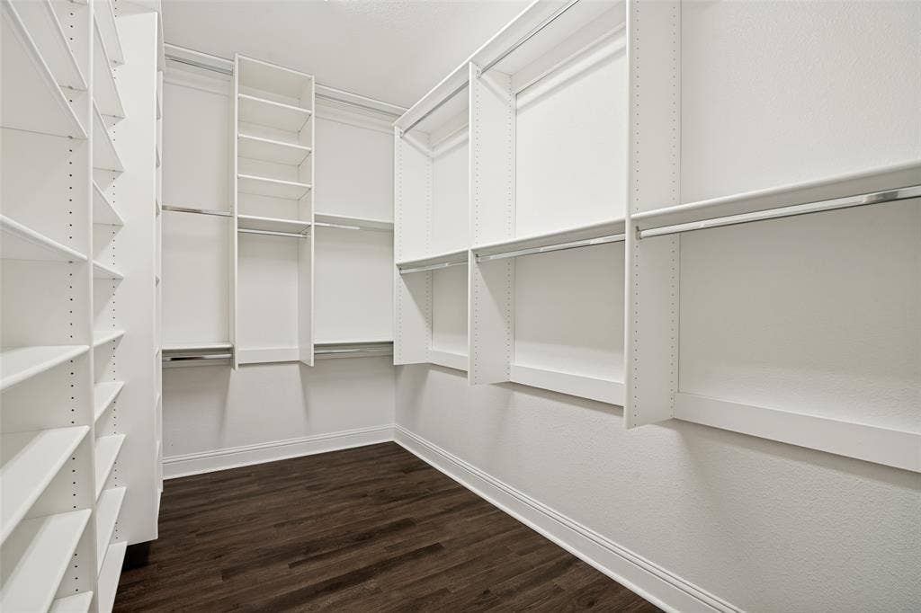 10002 Edgeway Circle, Rowlett, TX 75089 Custom closet system in enormous primary closet.