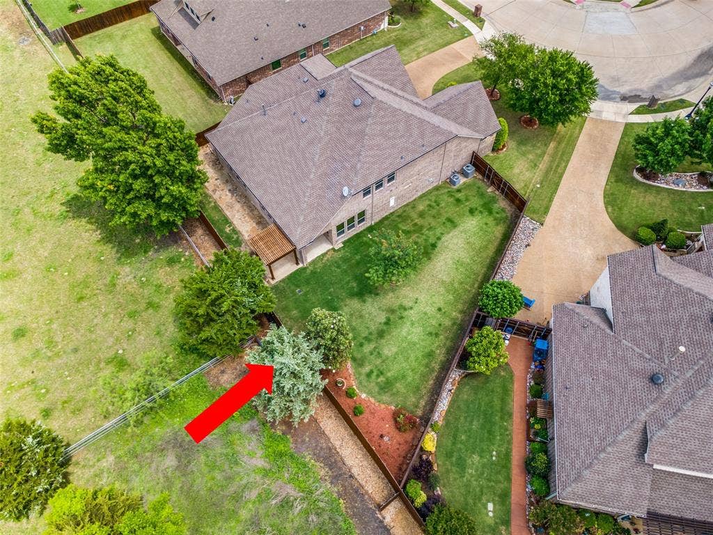 10002 Edgeway Circle, Rowlett, TX 75089 Aerial view of property from the rear showing pasture.