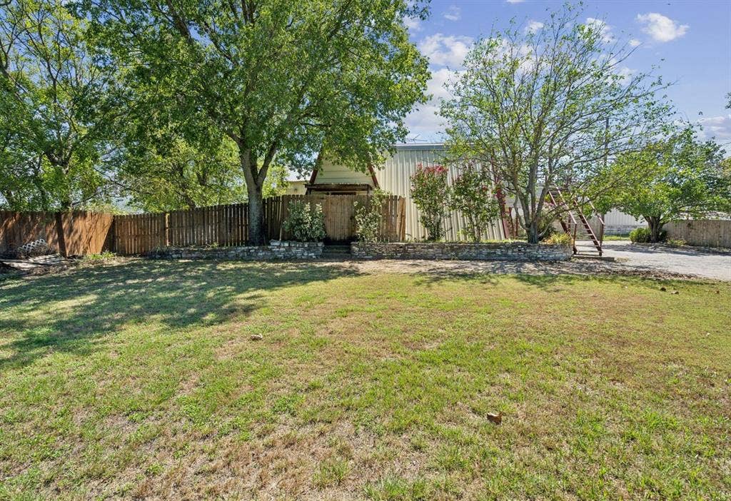 157 Business Boulevard, Granbury, TX 76049 View of yard featuring fence