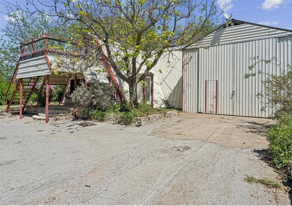 157 Business Boulevard, Granbury, TX 76049 View of outbuilding featuring stairs