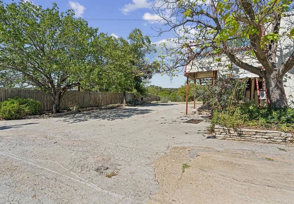 157 Business Boulevard, Granbury, TX 76049 View of yard with fence