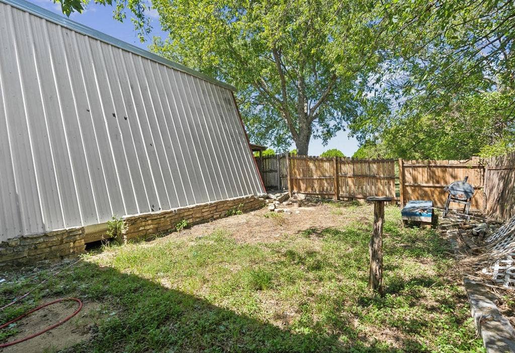 157 Business Boulevard, Granbury, TX 76049 View of yard featuring a fenced backyard