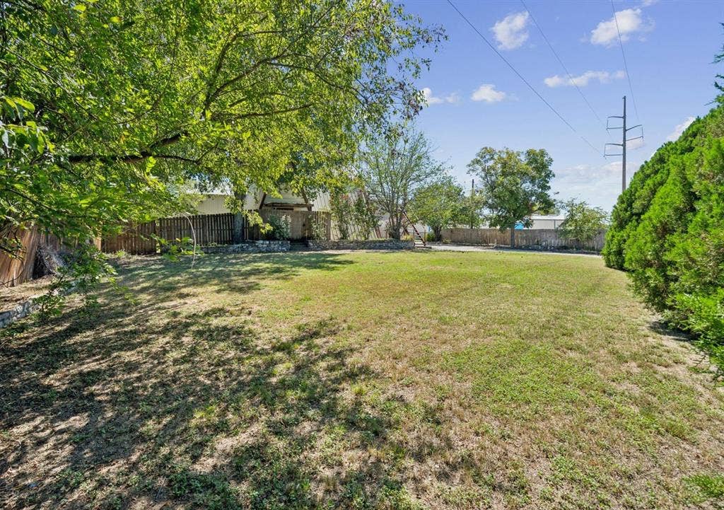 157 Business Boulevard, Granbury, TX 76049 View of yard featuring a fenced backyard